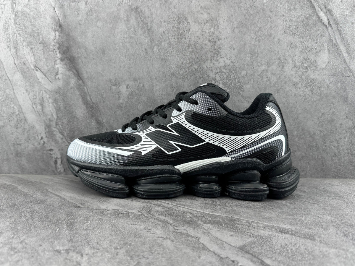 New Balance Running Sneakers in Black and White - product image from the listing.