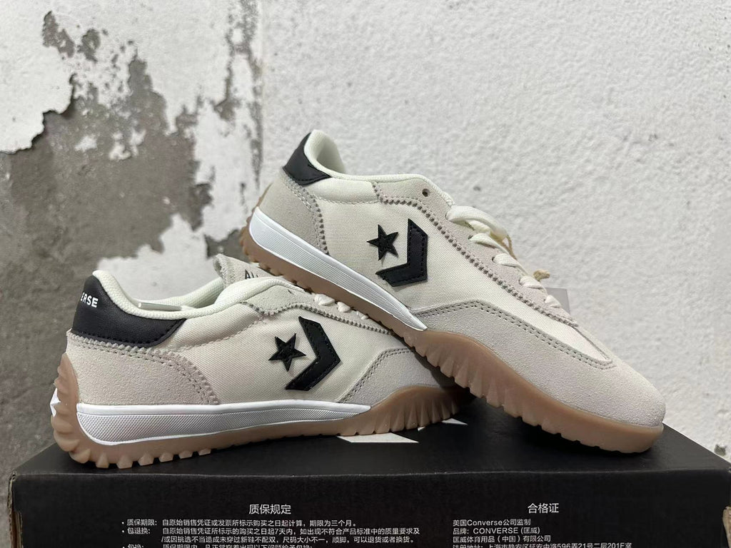 Cream and Black Converse Trainer-Style Sneakers - product image from the listing.
