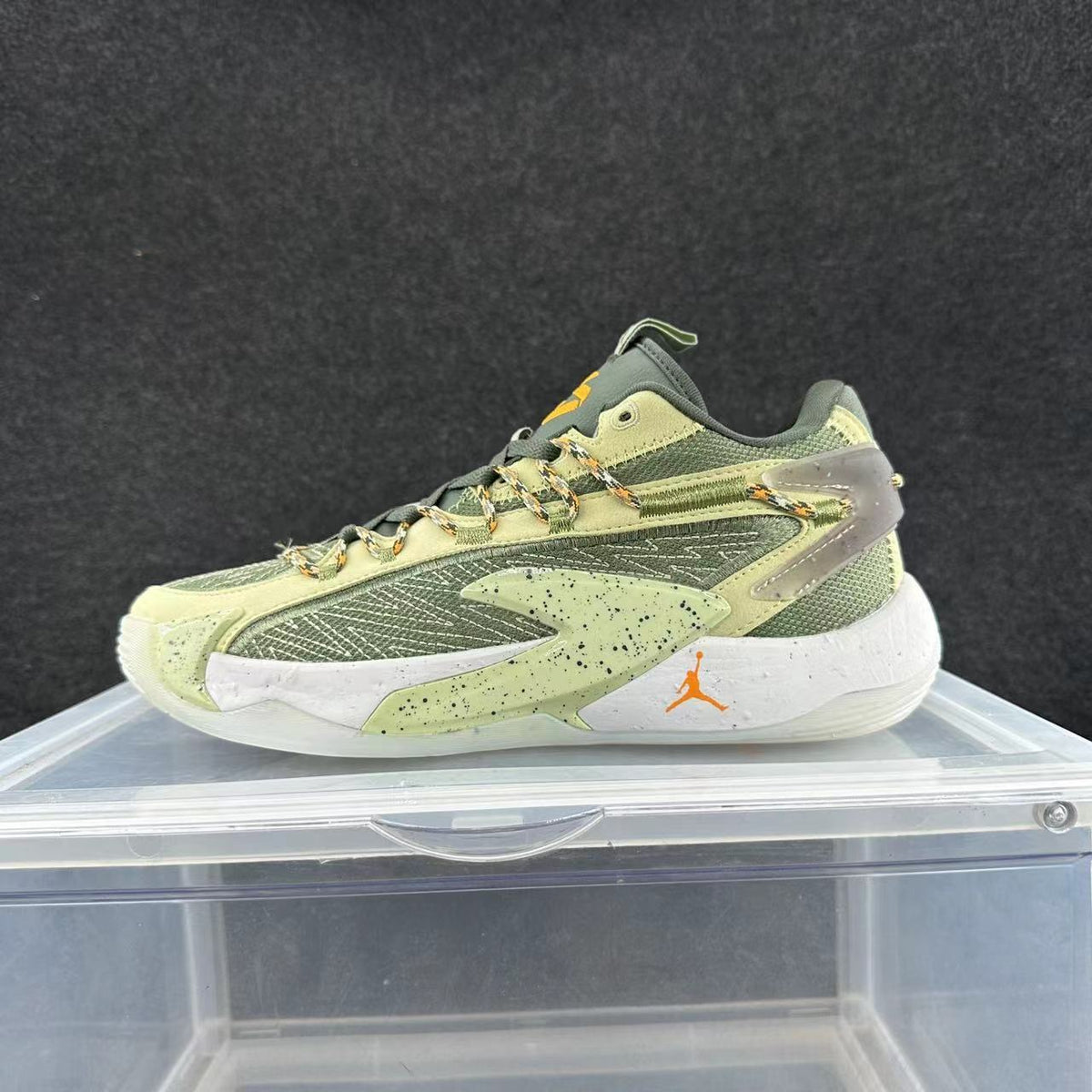 Jordan Basketball Sneakers in Green and Orange - product image from the listing.