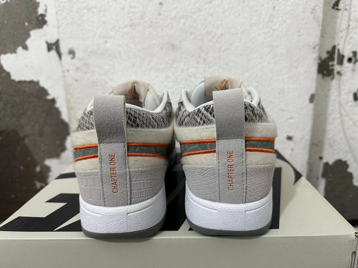 Gray and Orange Nike Book 1 Sneakers - product image from the listing.