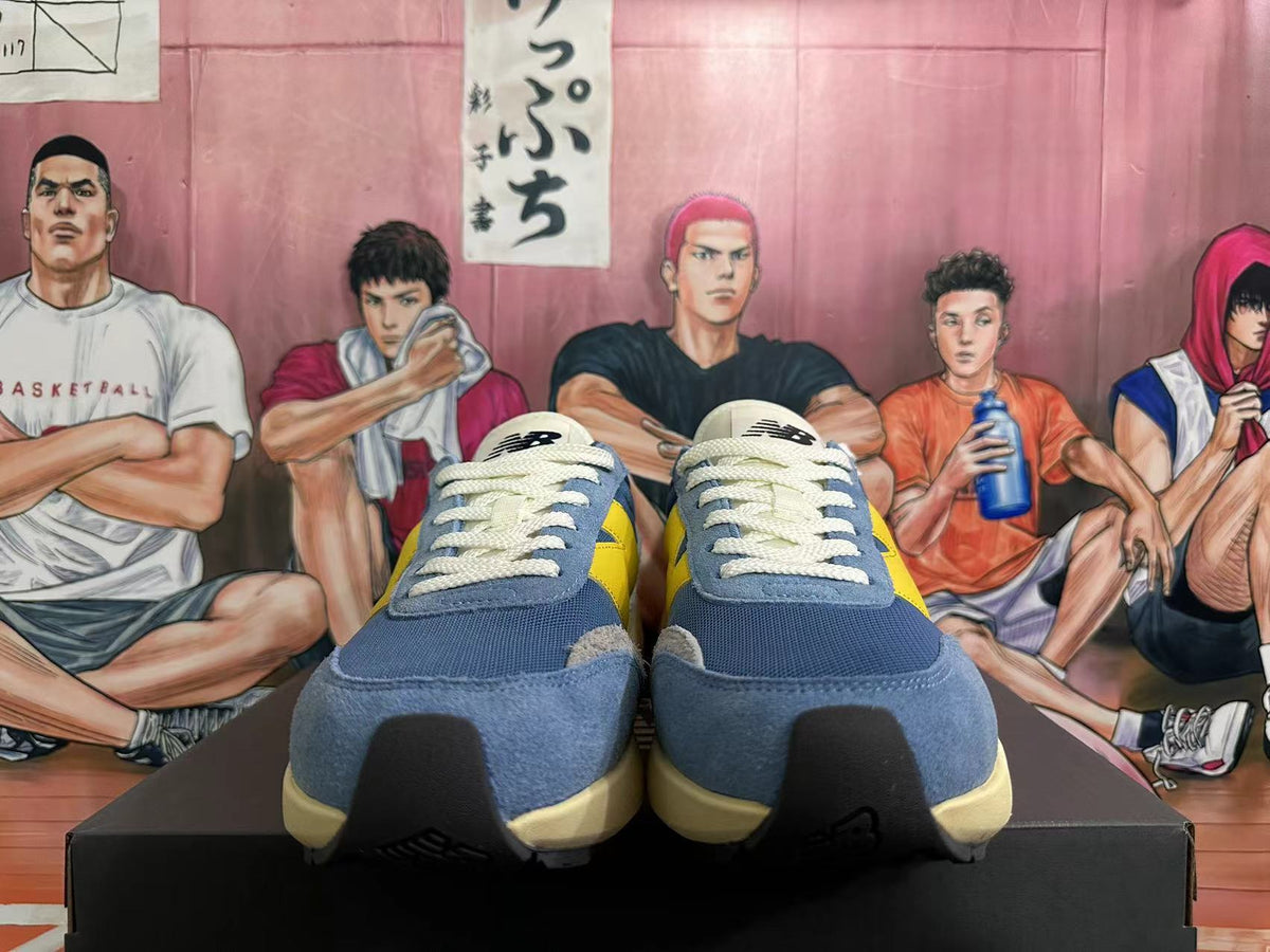 New Balance U370 Sneakers in Blue and Yellow - product image from the listing.
