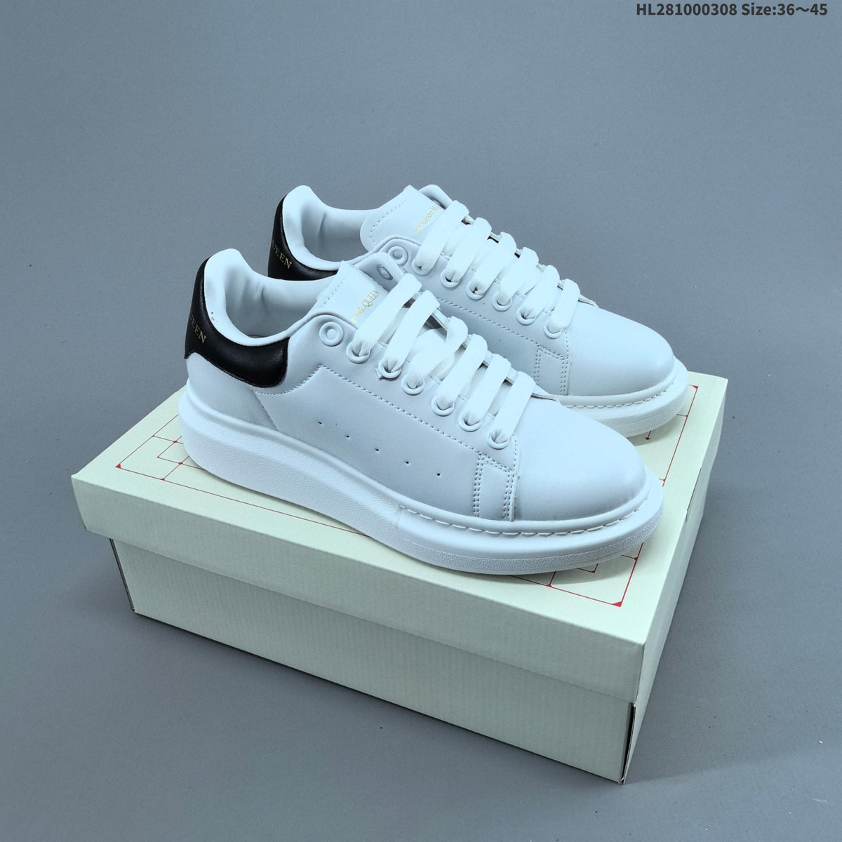 Alexander McQueen Oversized Low-Top Sneakers, in White and Black HL281000308 - product image from the listing.