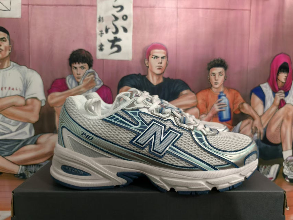 New Balance 740 Sneakers in White and Blue - product image from the listing.