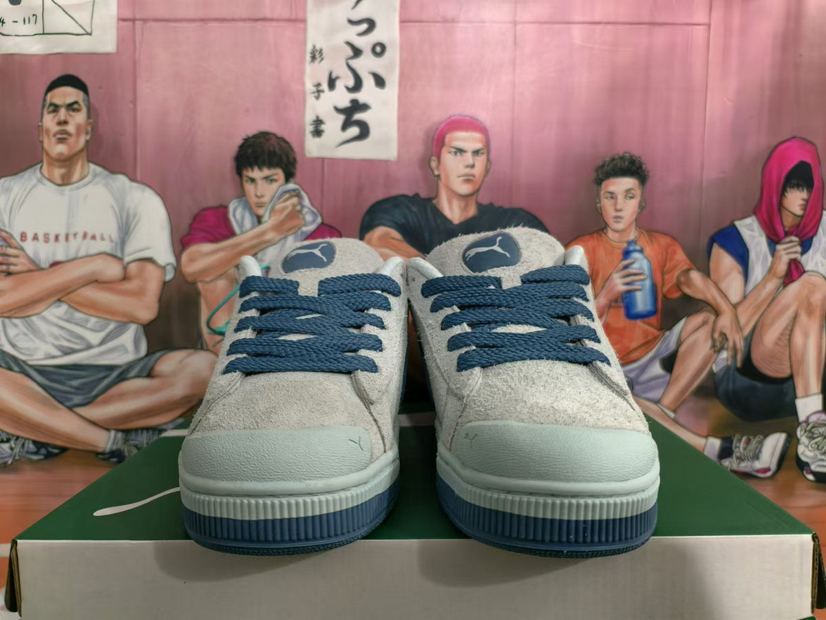 Blue and Gray Puma Suede Low-Top Sneakers - product image from the listing.