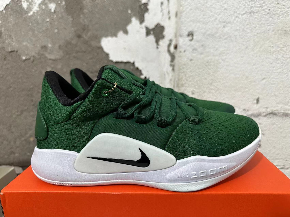 Green and White Nike Zoom Basketball Shoes - product image from the listing.