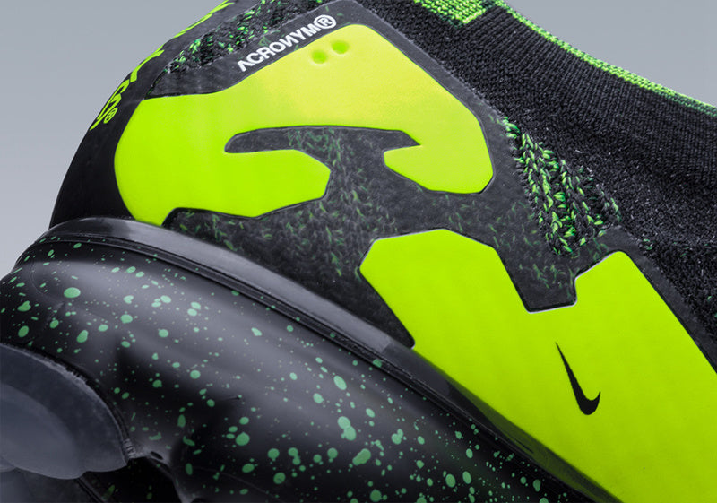 Nike Air VaporMax Moc 2 Acronym in Black Volt AQ0996-007 - product image from the listing.