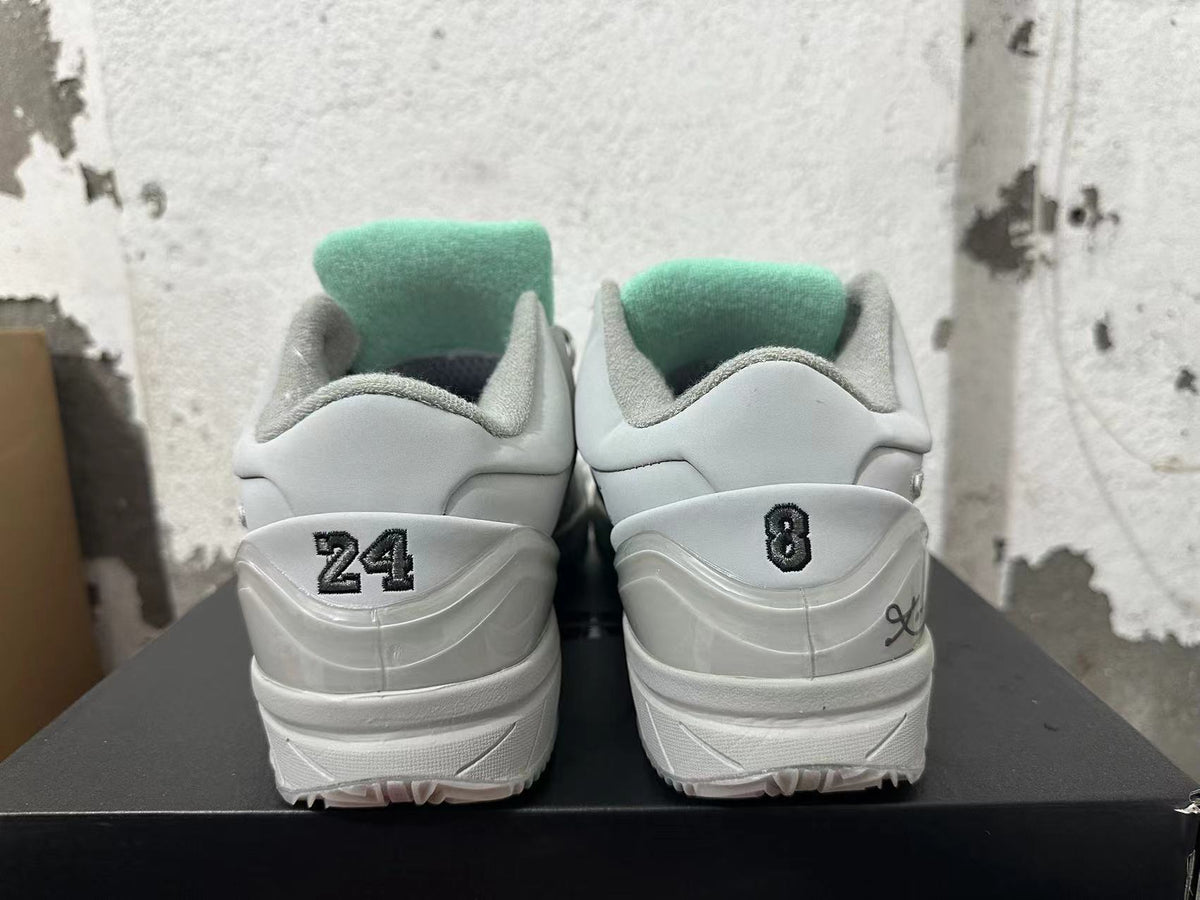 Nike Kobe 4 Protro Basketball Shoes, in White and Grey - product image from the listing.