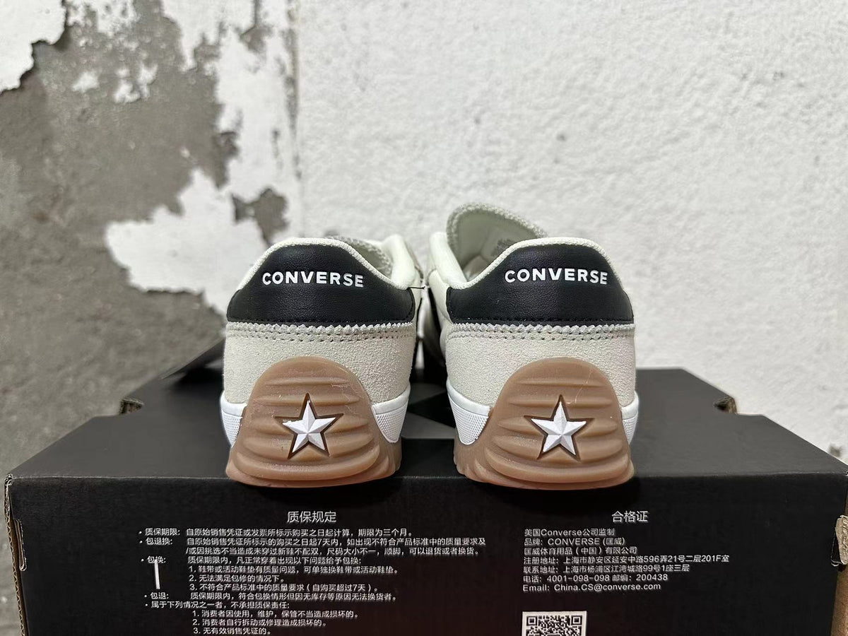 Cream and Black Converse Trainer-Style Sneakers - product image from the listing.