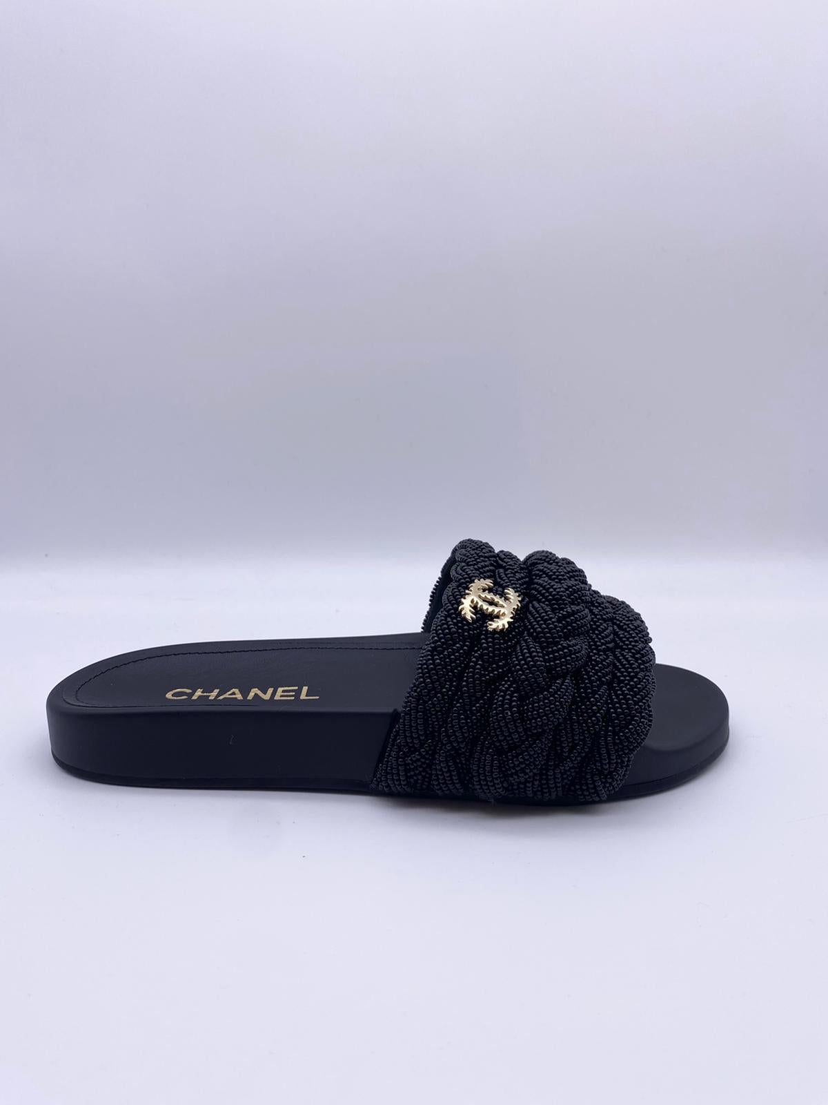 Chanel Pearl & Lambskin Woven Mule Slides in Black - product image from the listing.