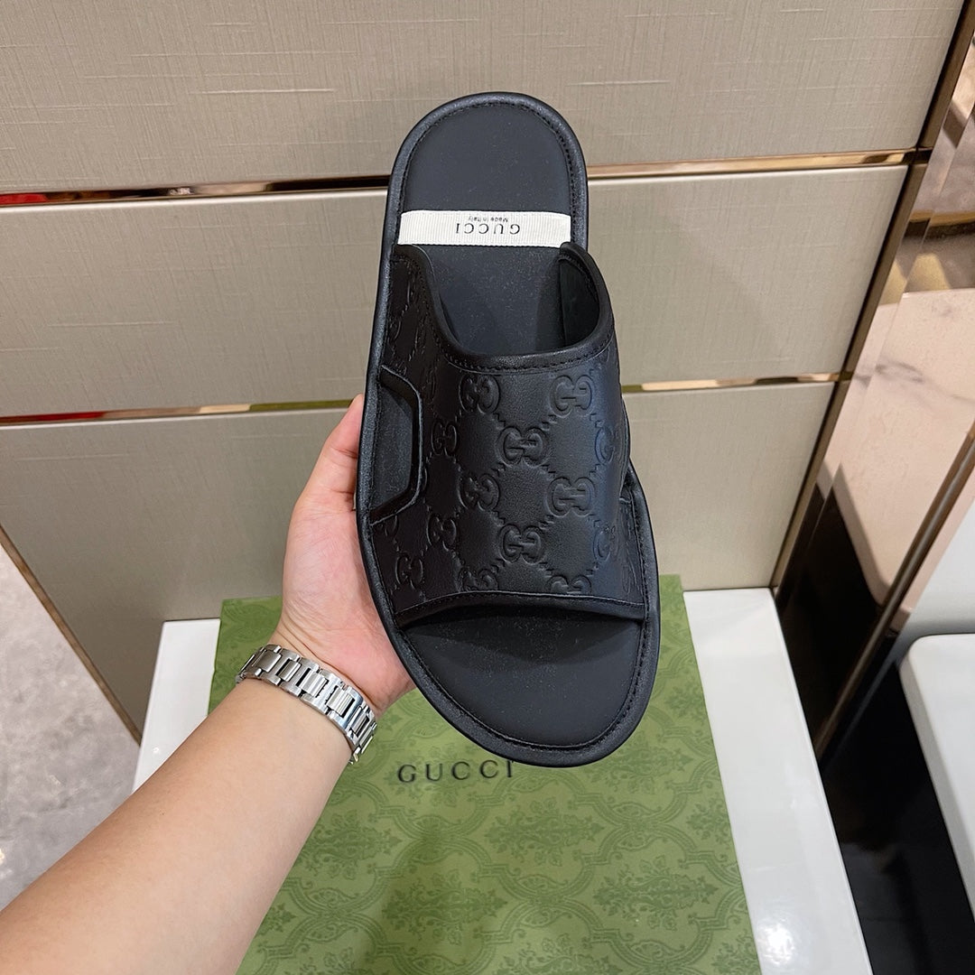 Men's Gucci Slides - product photo shown in the listing for this item.