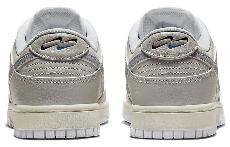 Nike Dunk Low in Metallic Silver - product image from the listing.
