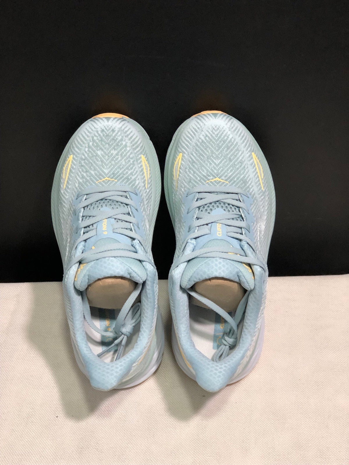 ONE ONE Clifton 9 by HOKA - product photo shown in the listing for this item.